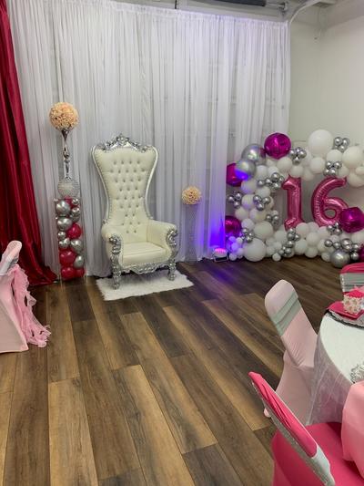 Birthday Girl chair by the decorated garage door. 
